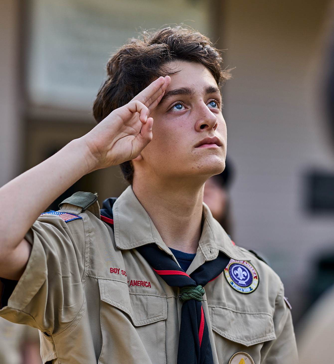 Boyscout saluting American Flag
